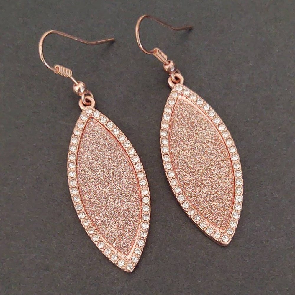 Sparkly rose gold dangle earrings with cz accents